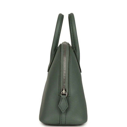 Mini Bolide handbag in dark green textured leather with front zipper and hanging pull