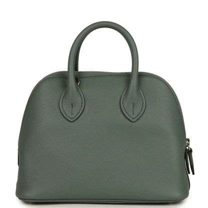 Mini Bolide handbag in dark green textured leather with two top handles