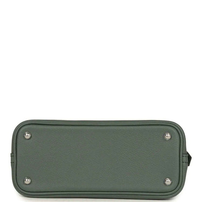 Mini Bolide handbag in dark green textured leather with flat base and silver feet