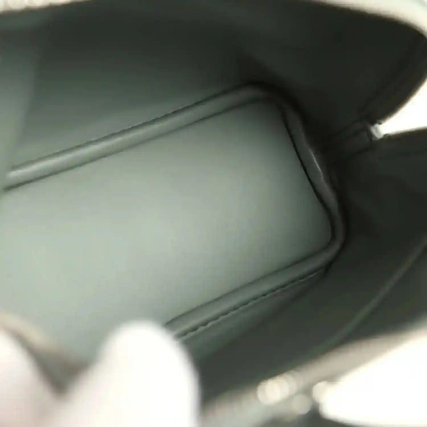 Mini Bolide handbag interior with smooth dark green leather lining