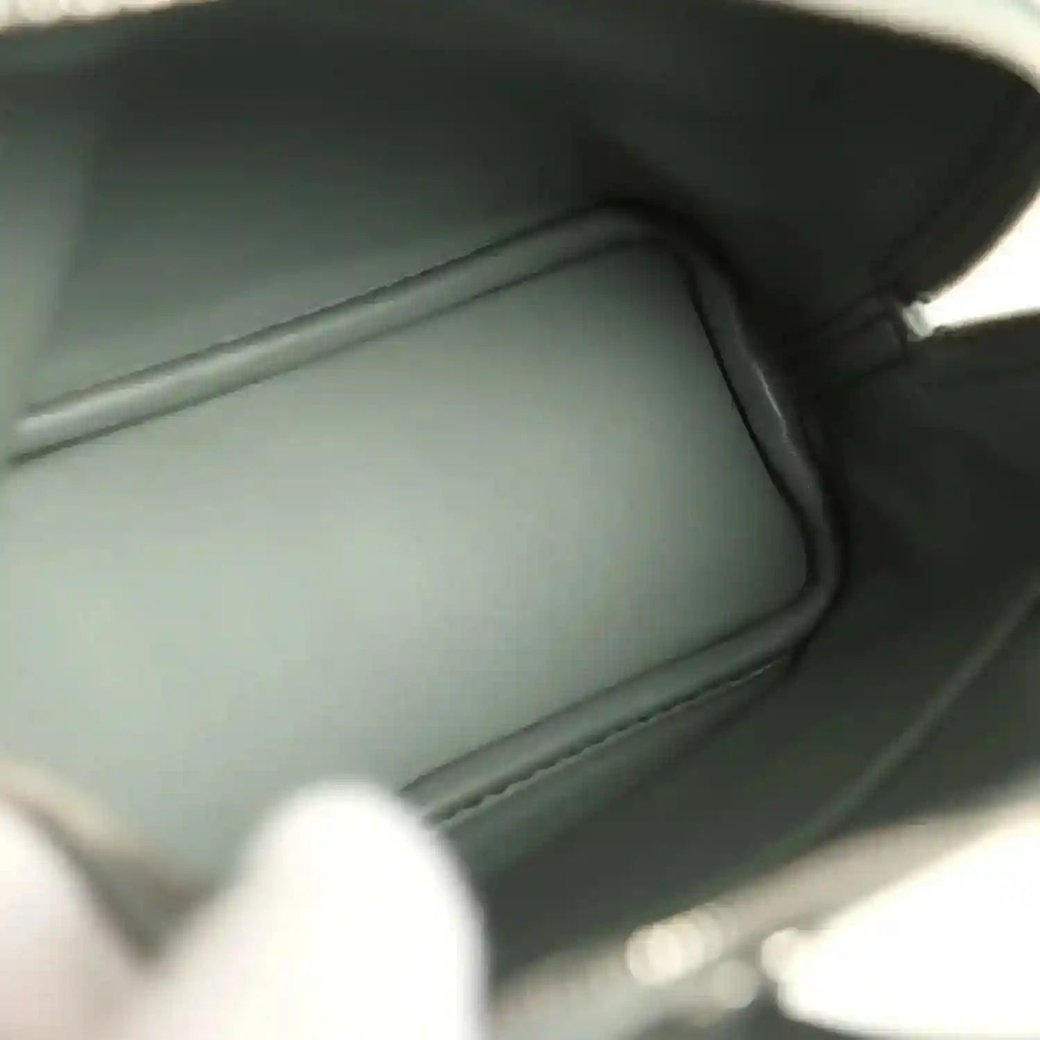 Mini Bolide handbag interior with smooth dark green leather lining