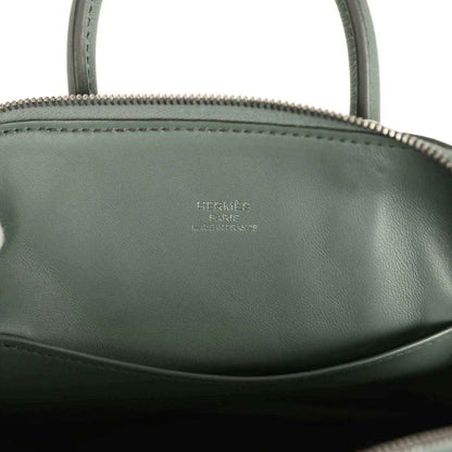 Mini Bolide handbag with Hermes logo on dark green leather lining