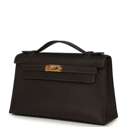 Dark brown leather pochette with gold-tone front clasp and exterior strap details
