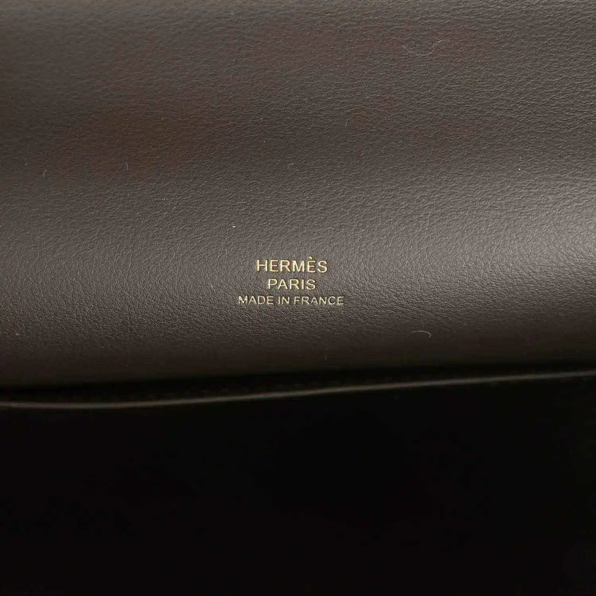Hermès Paris made in France stamp on dark brown leather