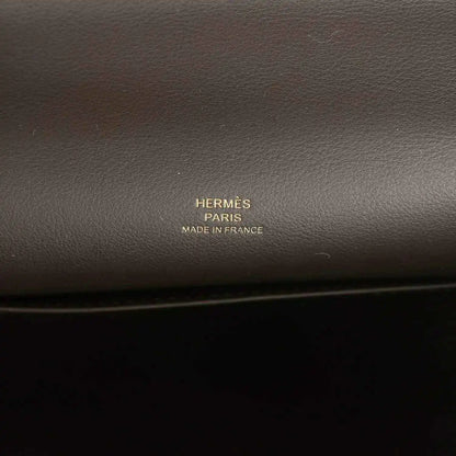 Hermès Paris made in France stamp on dark brown leather