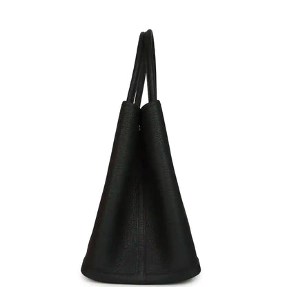 Black leather tote with tapered sides and two short top handles