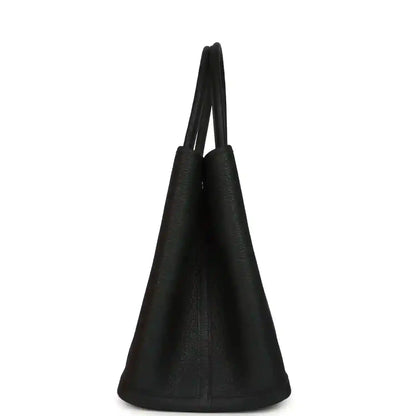 Black leather tote with tapered sides and two short top handles