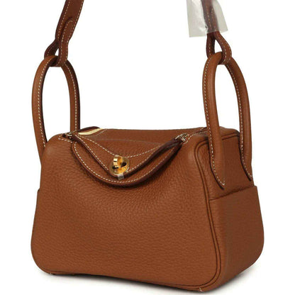 Mini Lindy bag in tan textured leather with gold-tone clasp and side detail