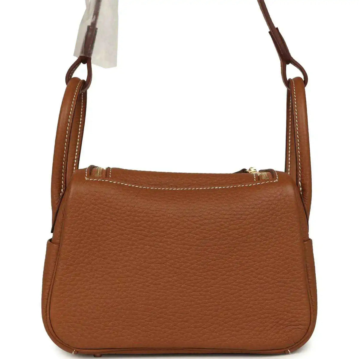 Mini Lindy bag in tan textured leather with top handles and stitched frame