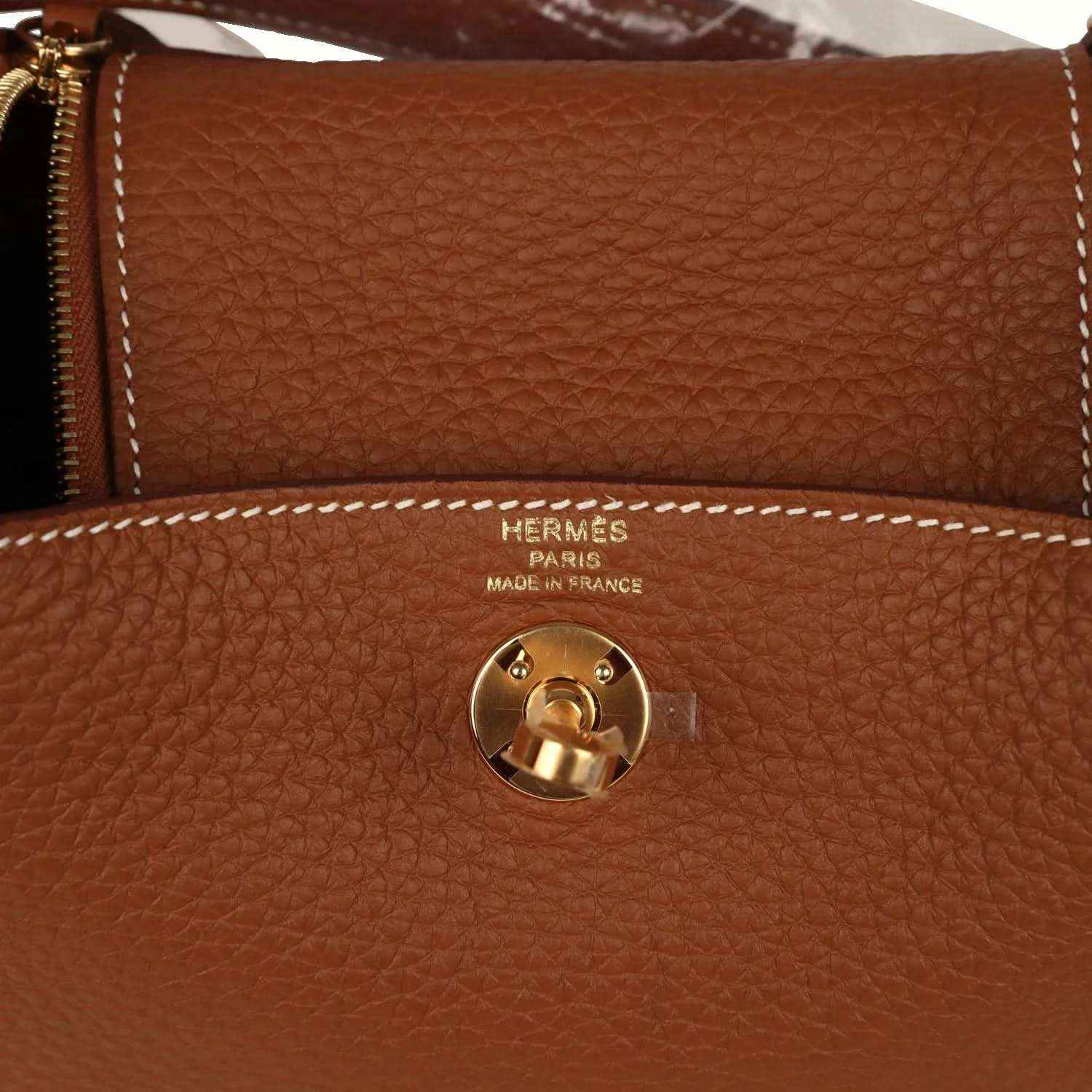 Hermes Mini Lindy bag in tan textured leather with gold-tone turn-lock and HERMES Paris