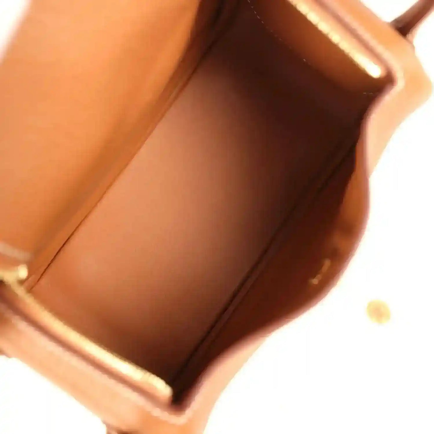 Mini Lindy bag interior with tan leather lining and stitched side seam