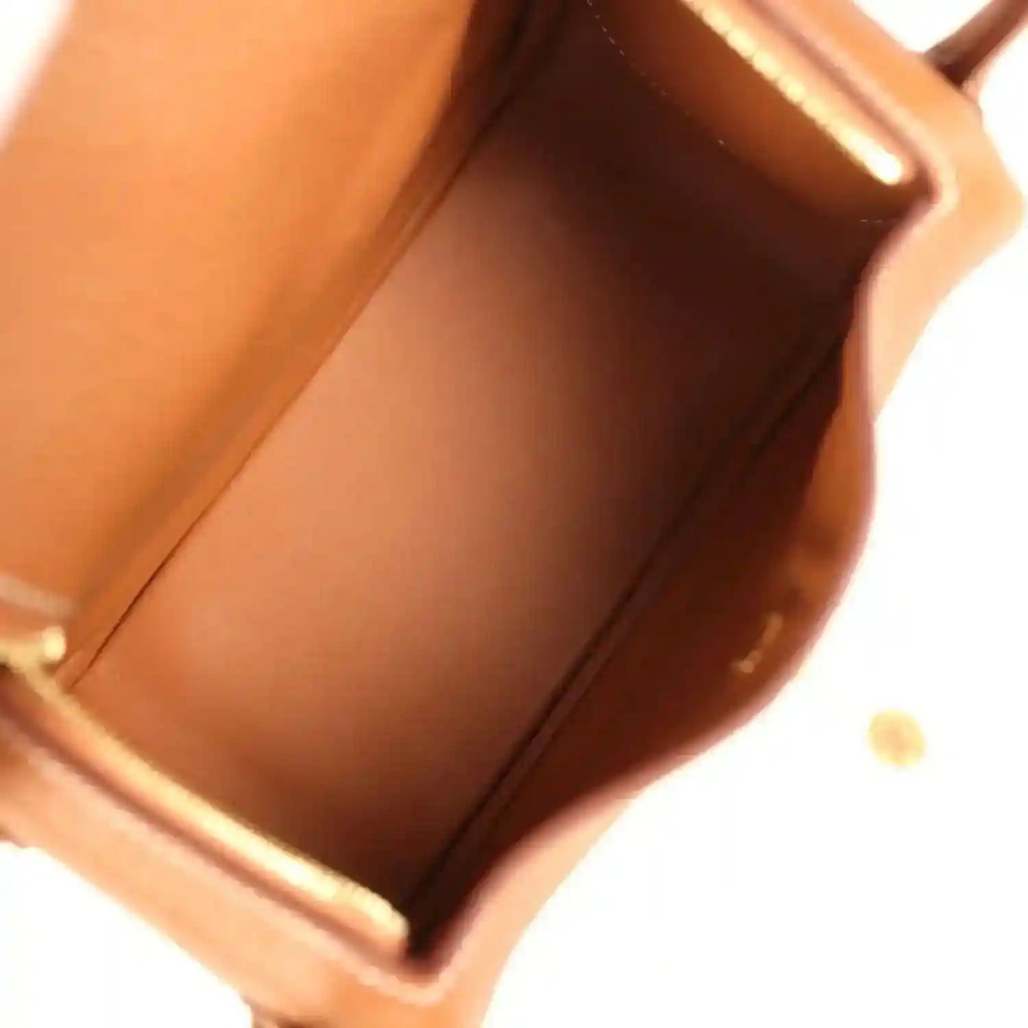 Mini Lindy bag interior with tan leather lining and stitched side seam