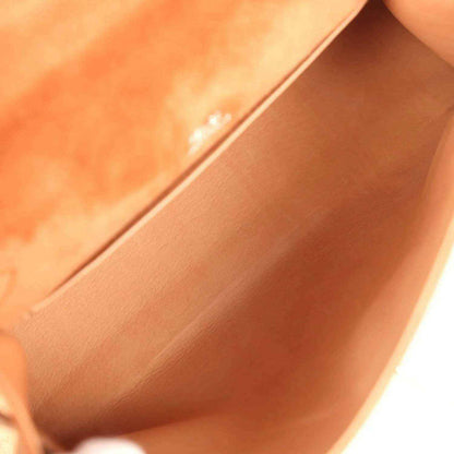 Suede interior of Hermès Kelly-style pochette with seam and lining, fauve
