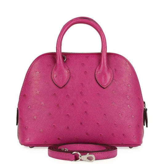 Mini Bolide bag in rose purple ostrich leather with top handles and crossbody strap.