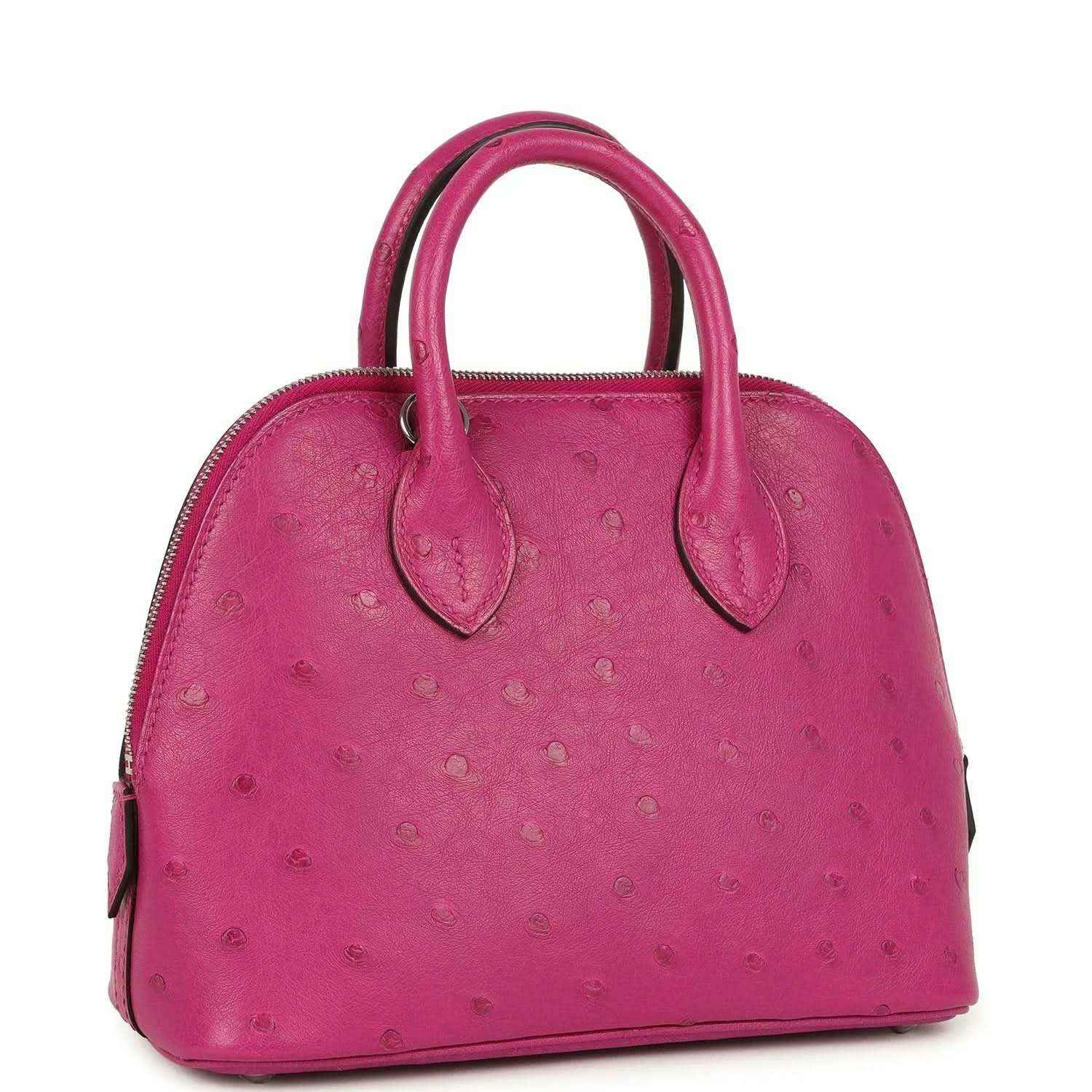 Mini Bolide bag in rose purple ostrich leather with top handles and zip opening.