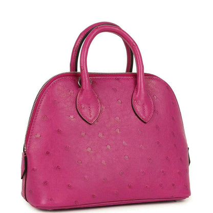 Mini Bolide bag in rose purple ostrich leather with top handles and zip opening.