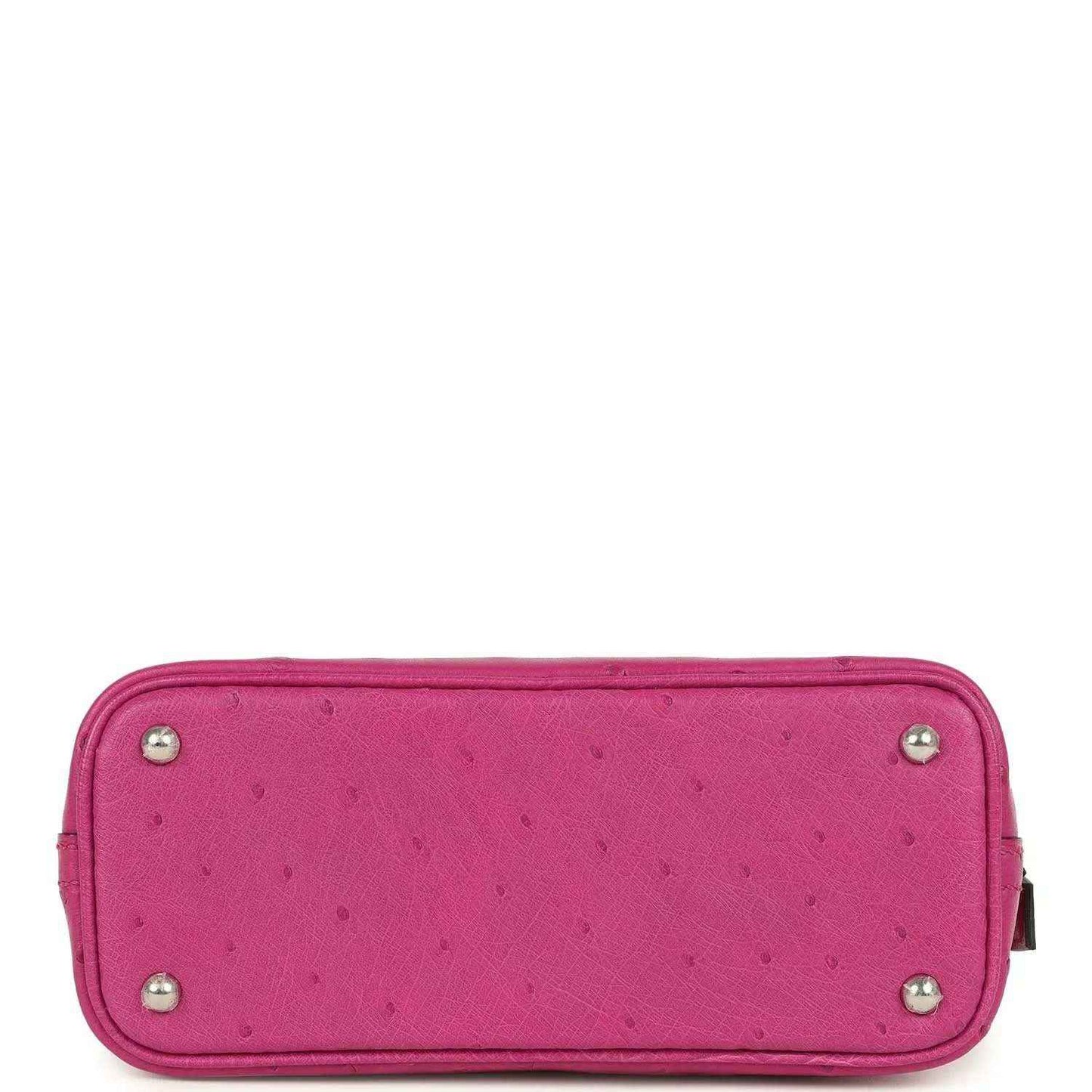 Mini Bolide bag bottom view in rose purple ostrich leather with corner feet studs.