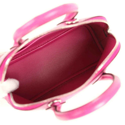 Mini Bolide bag open view showing pink interior lining and zipper closure.
