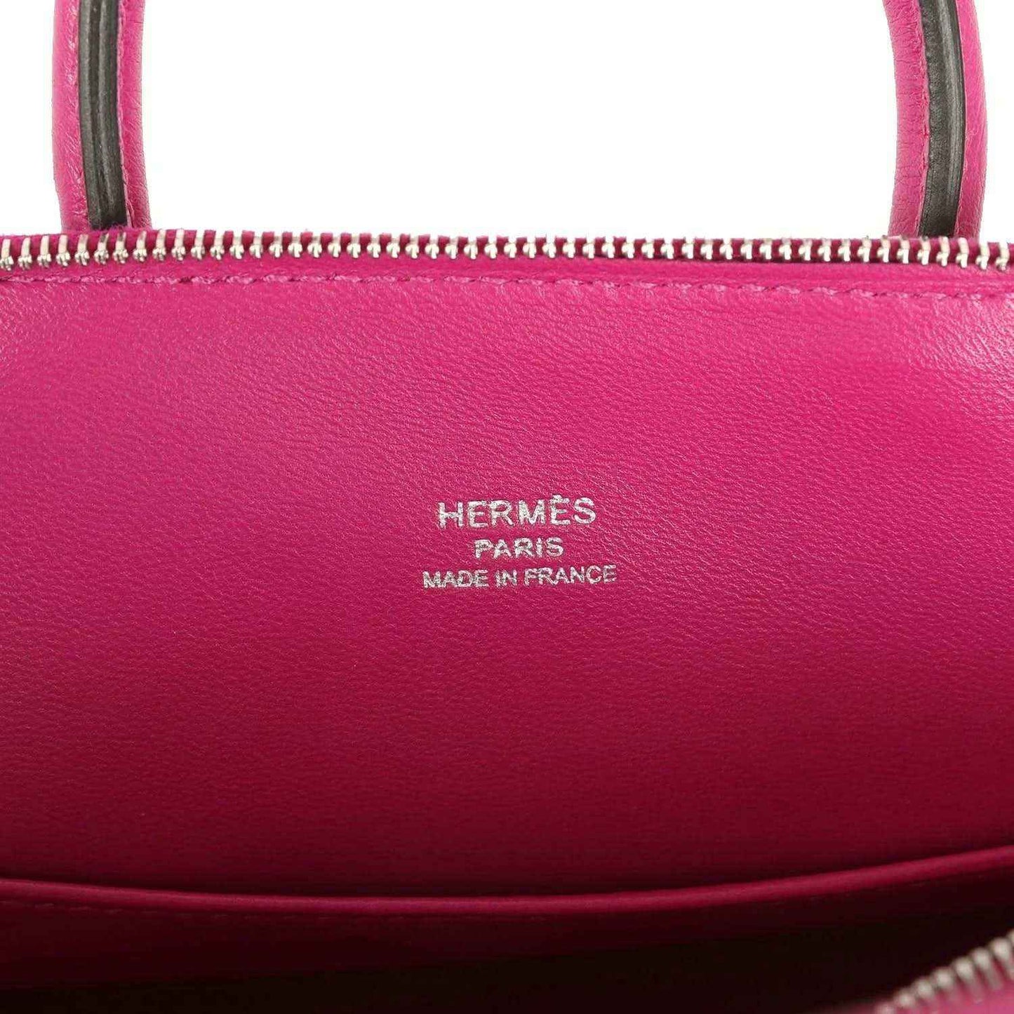 Hermes Mini Bolide bag with 'Hermes Paris' and 'Made in France' stamped on leather.