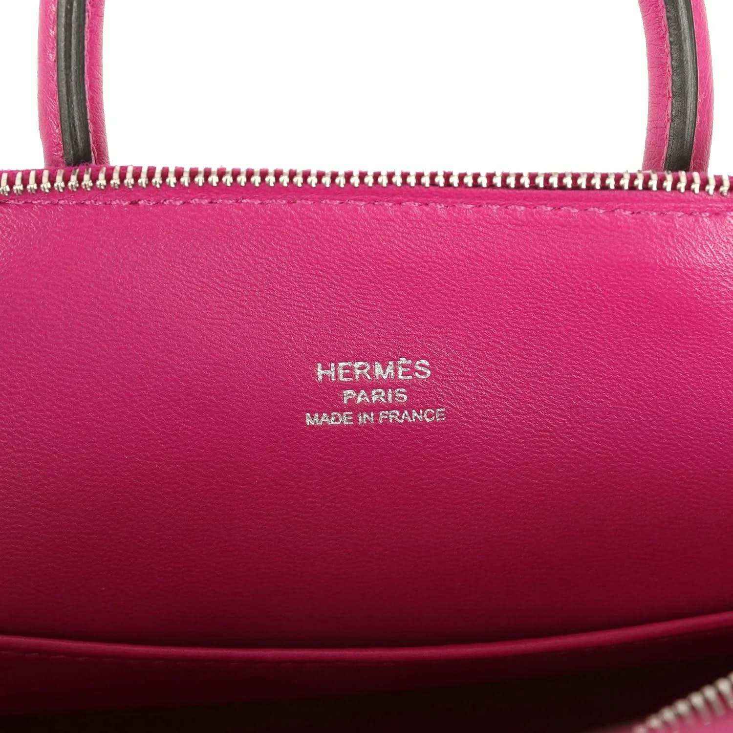 Hermes Mini Bolide bag with 'Hermes Paris' and 'Made in France' stamped on leather.
