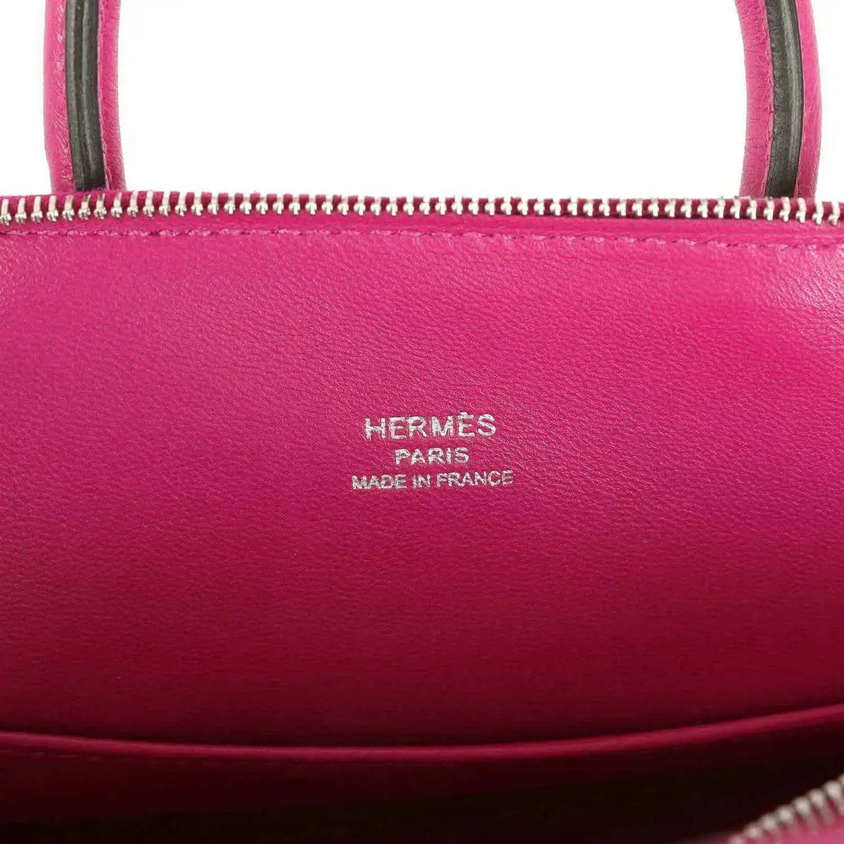 Hermes Mini Bolide bag with 'Hermes Paris' and 'Made in France' stamped on leather.