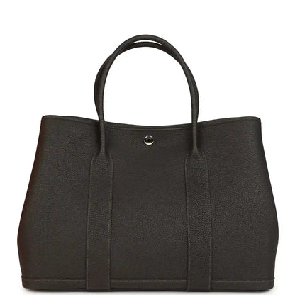 Leather tote bag front view with top handles and small metal clasp, dark brown.