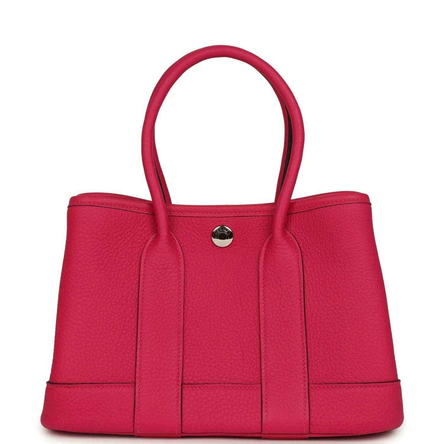 Rose pink leather tote bag with top handles and round metal front snap closure