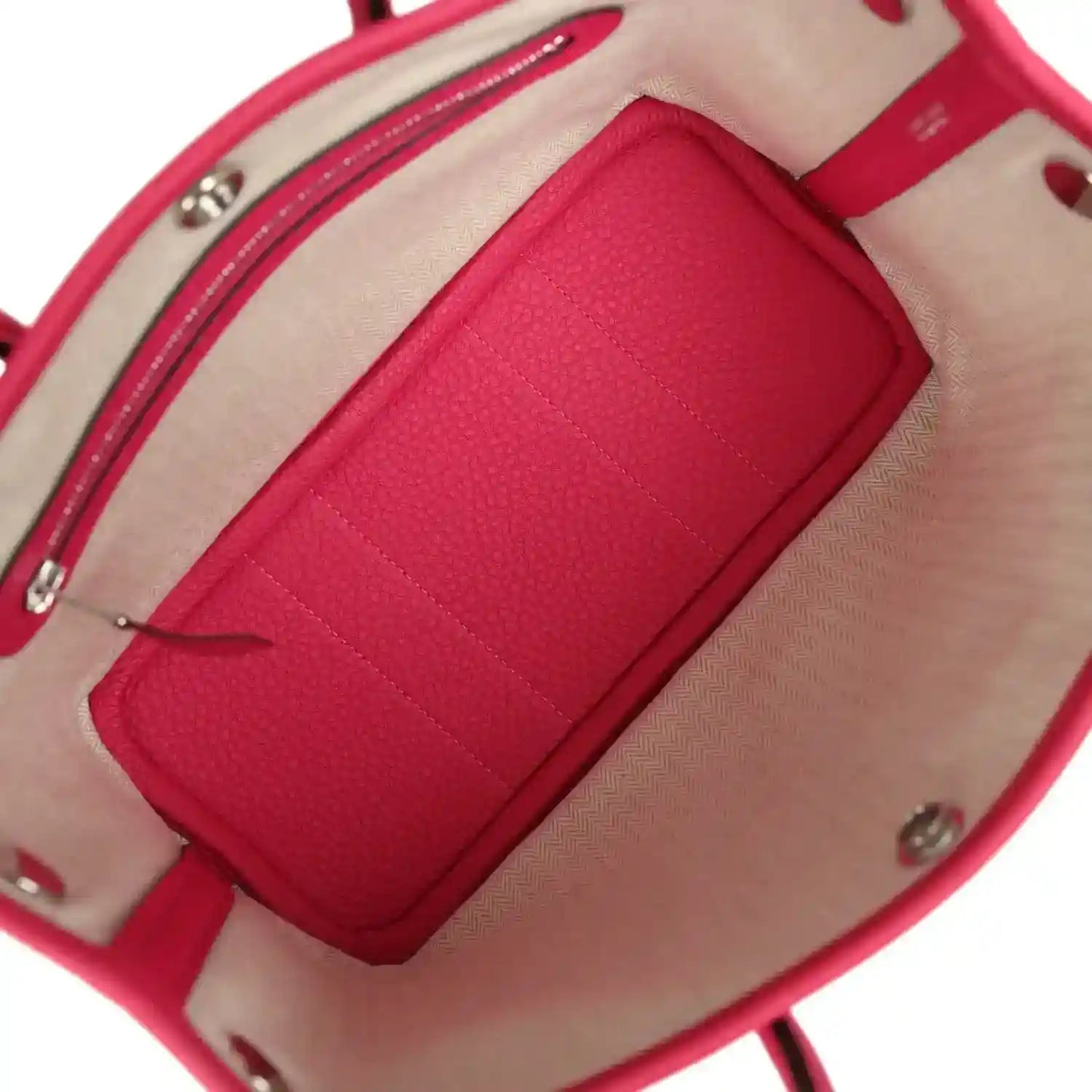 Rose pink leather tote bag interior with zip pocket and beige lining