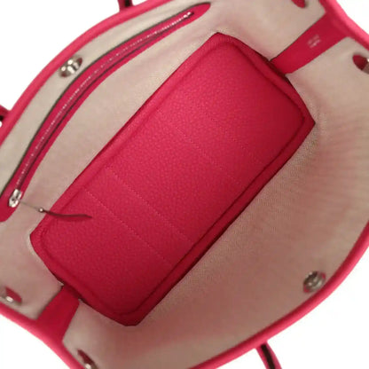 Rose pink leather tote bag interior with zip pocket and beige lining