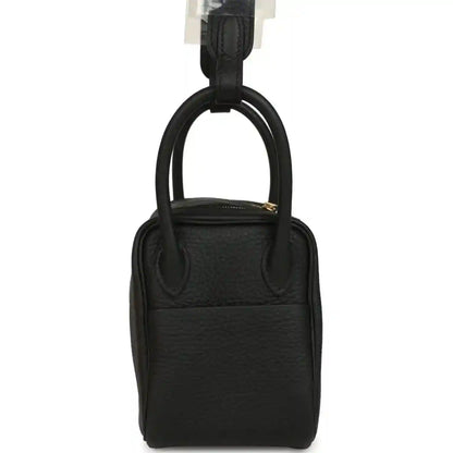 Hermes Mini Lindy II mini bag in black textured leather with top handle and compact silhouette
