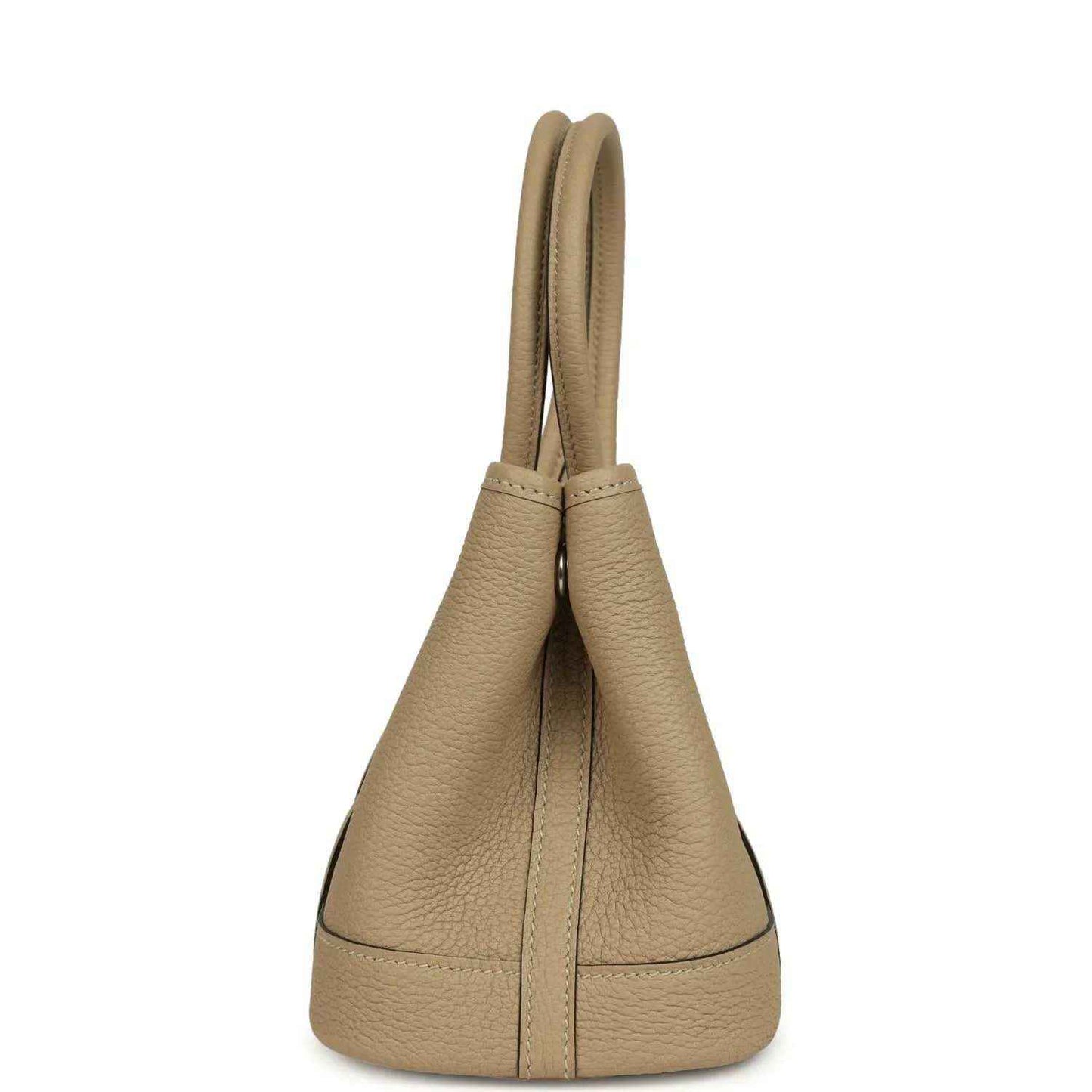 Trench leather tote with curved top handles and vertical side seam detail