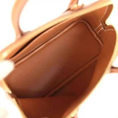 Hermes Bolide mini bag interior view showing brown lining and stitched leather edges