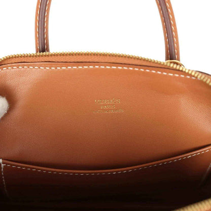 Hermes Bolide mini bag interior with embossed logo and brown leather lining under zipper