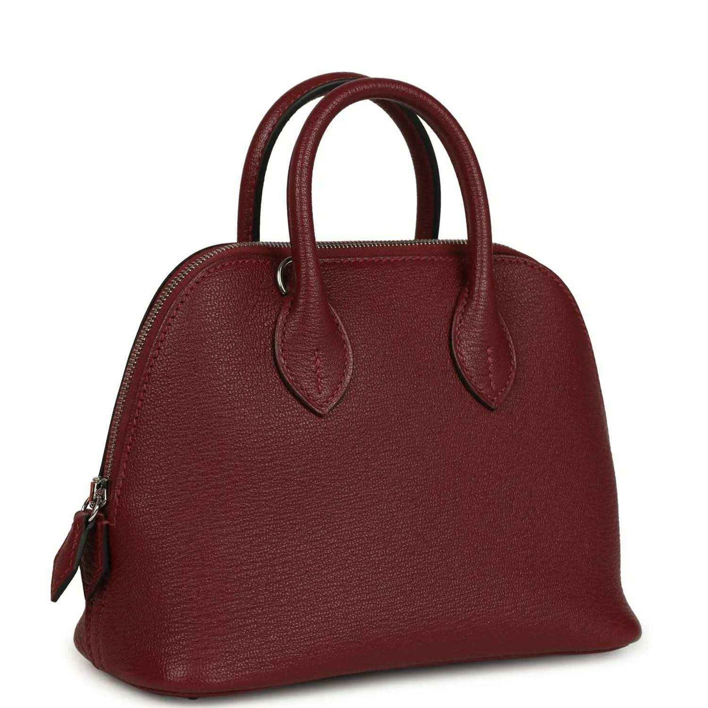 Mini leather handbag with top handles and side hardware in deep red