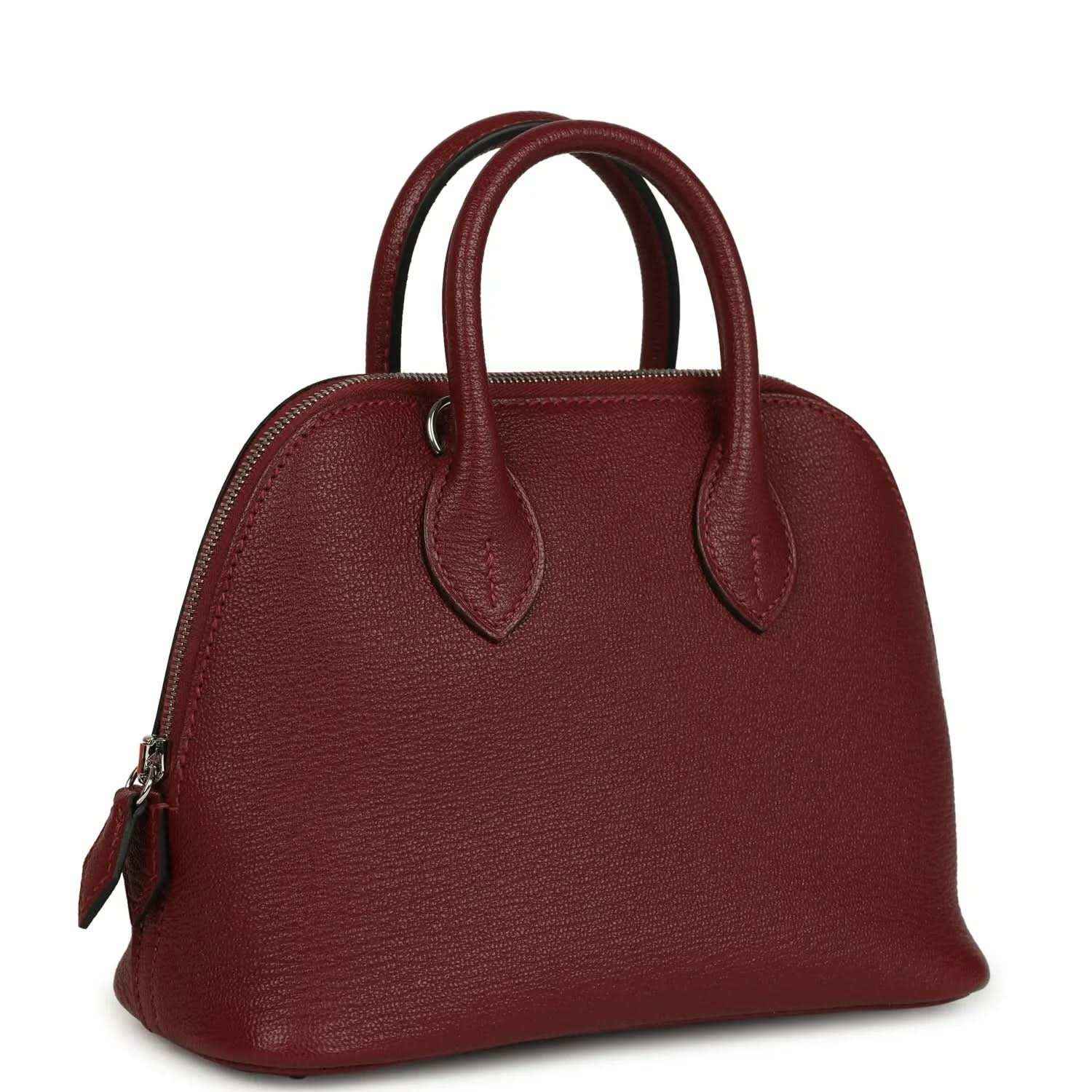 Mini leather handbag with top handles and side hardware in deep red