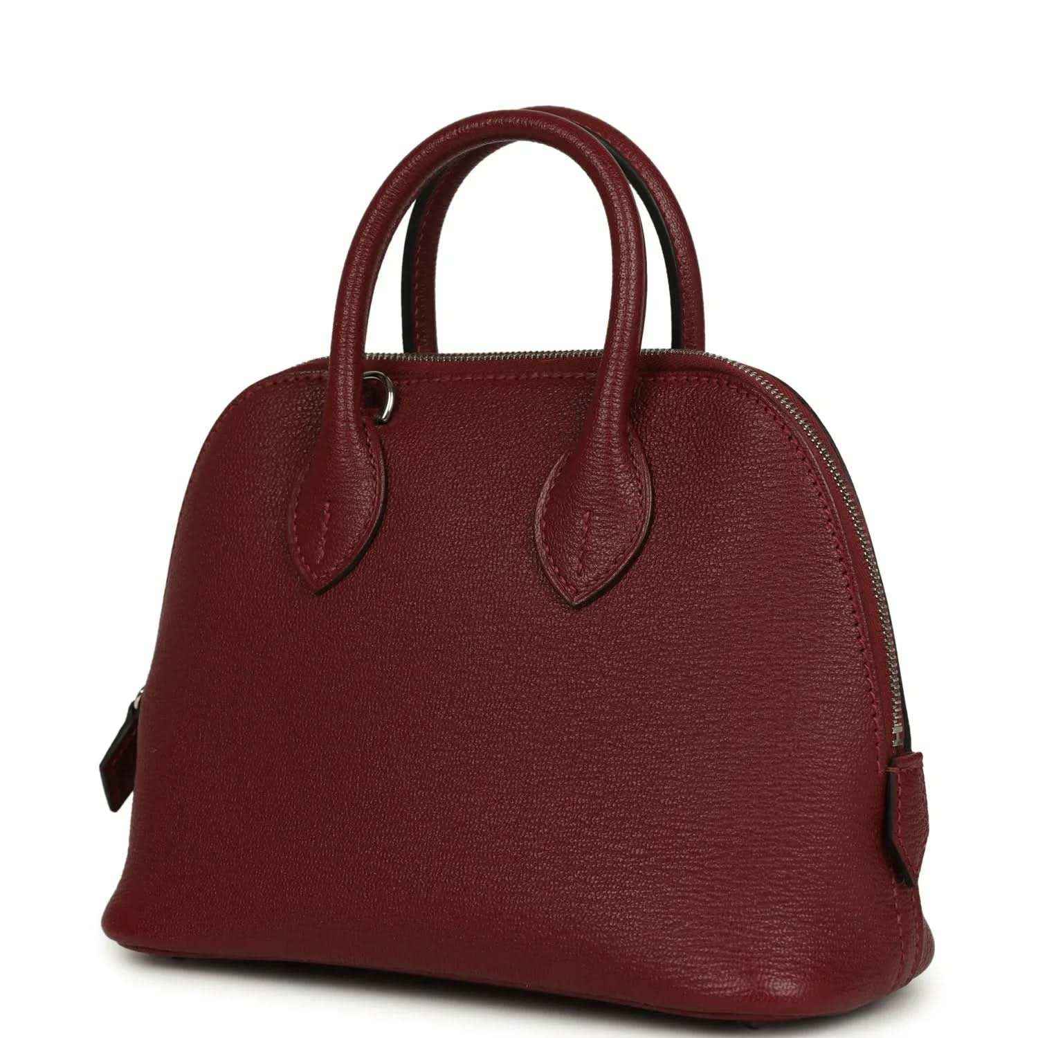 Mini leather handbag with domed silhouette and top handles in deep red leather