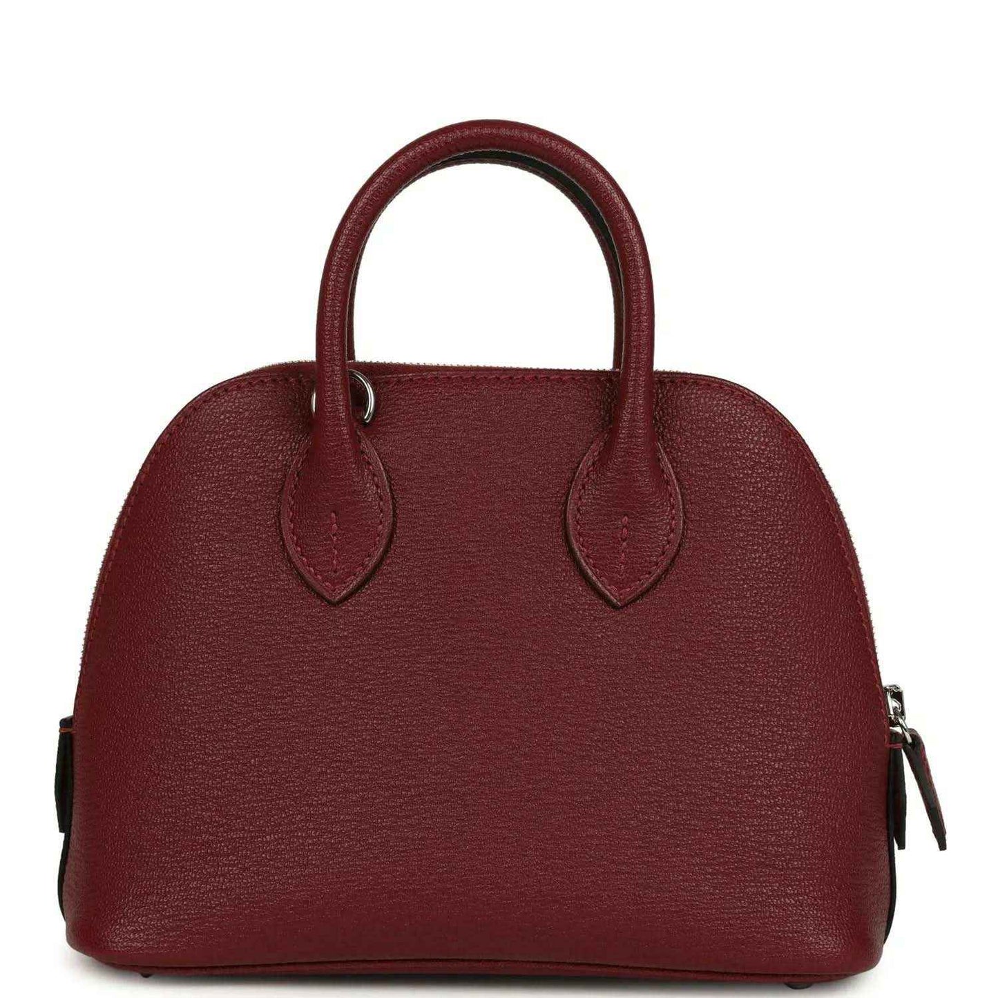 Mini leather handbag with top handles and side zipper pulls in deep red