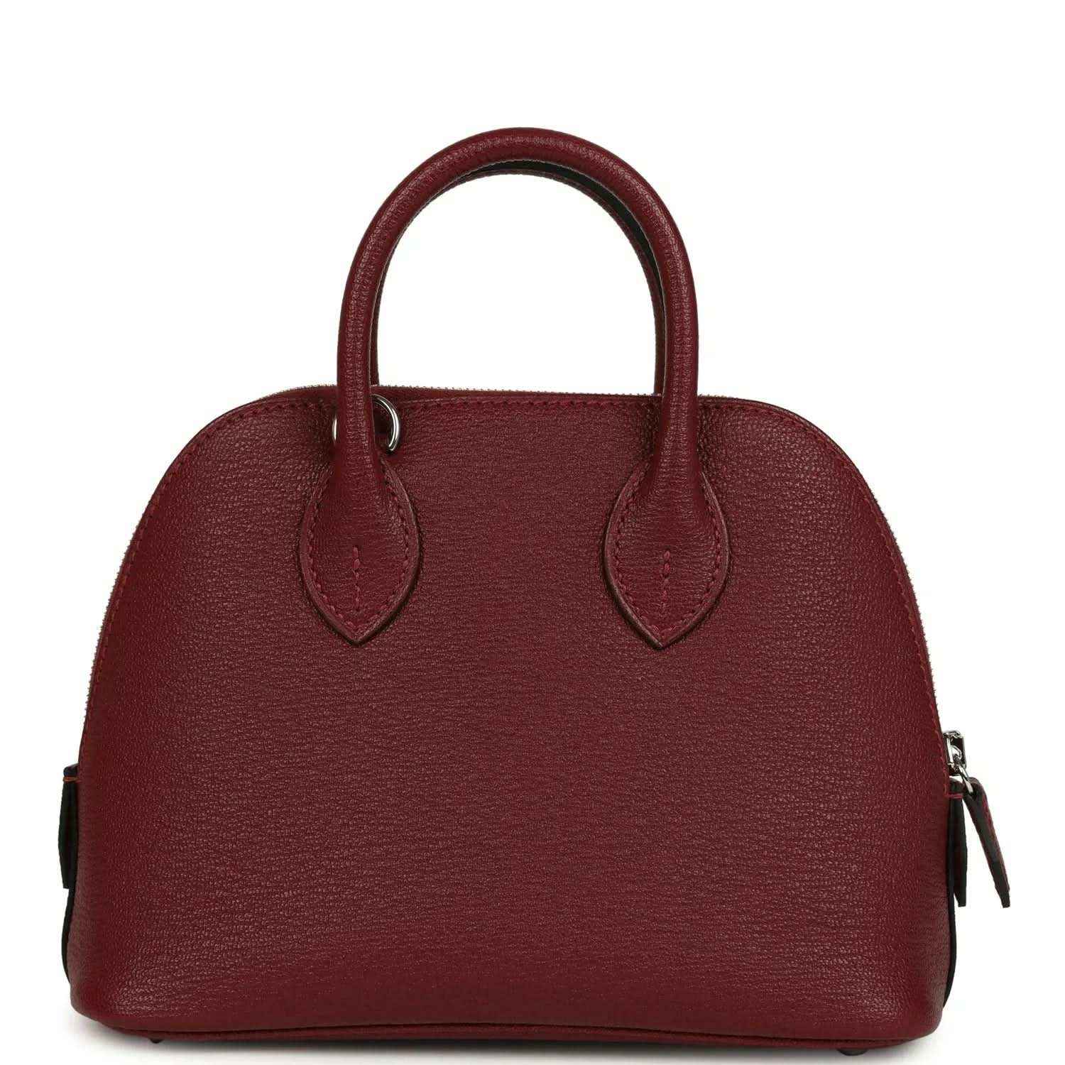 Mini leather handbag with top handles and side zipper pulls in deep red
