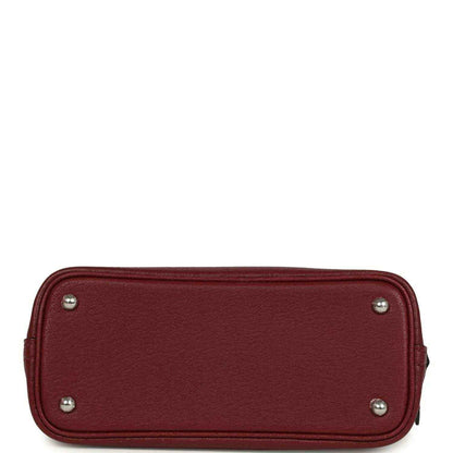 Mini leather handbag back panel with metal corner studs in deep red