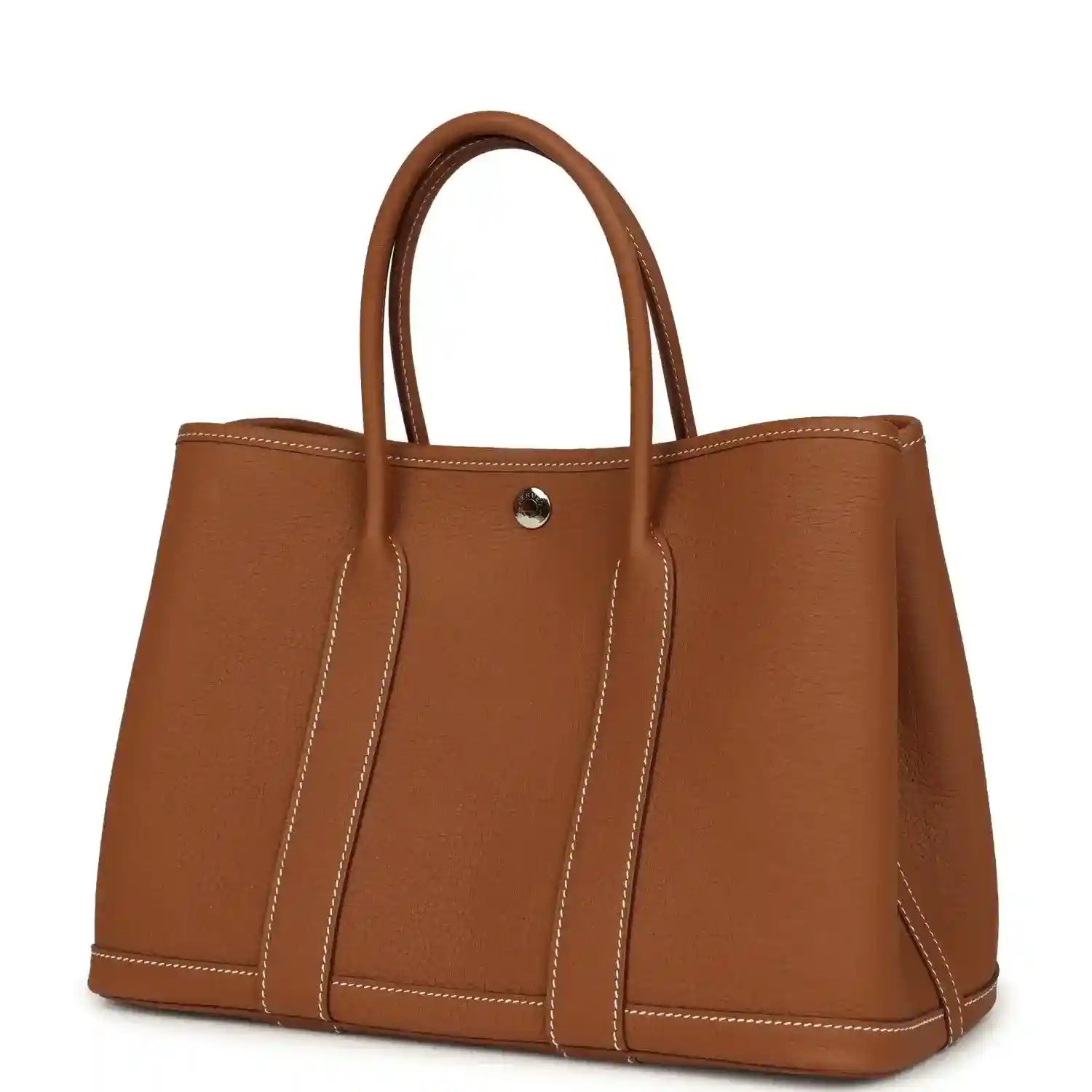 Brown leather tote bag with structured sides, two handles, and gold-tone snap