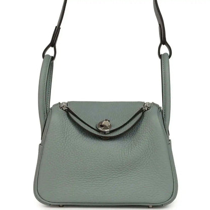 Mini leather handbag with top handles and front flap clasp, gray-green tone