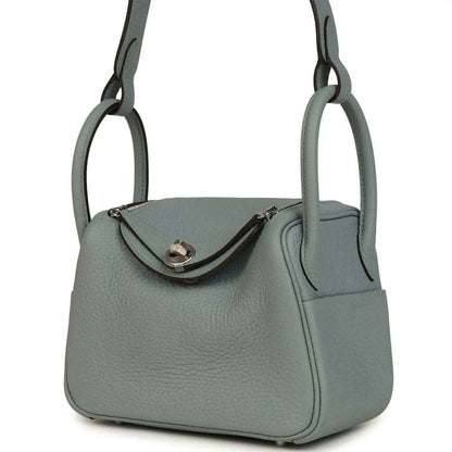 Mini leather handbag with front flap and side pocket, gray-green leather
