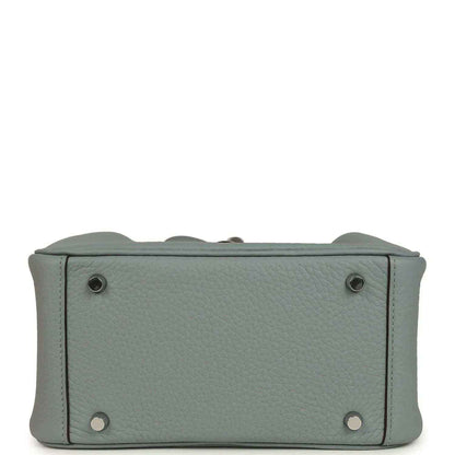 Mini leather handbag with corner studs and flap edges, gray-green tone