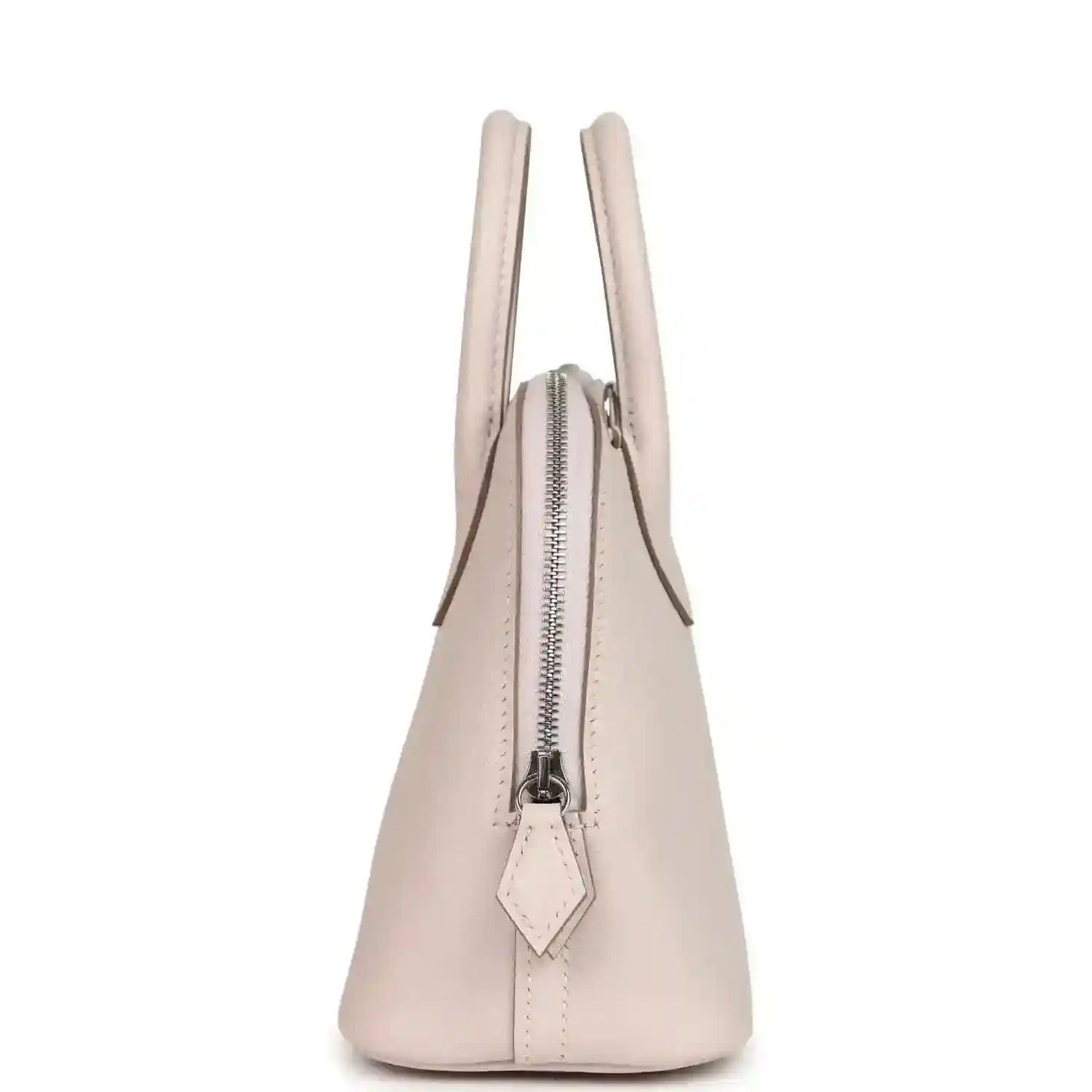 Mauve mini handbag side view with vertical zipper and leather pull tab