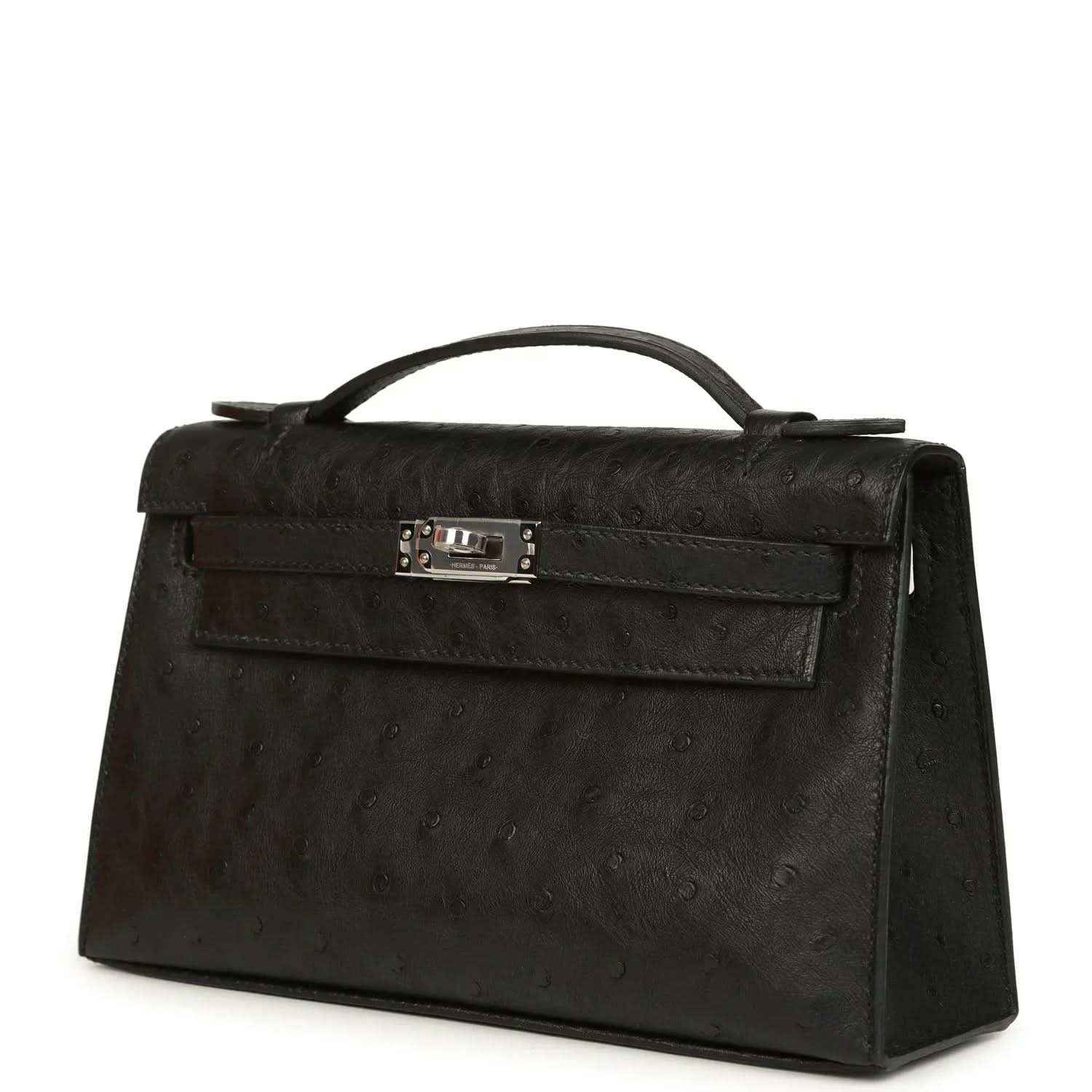 Black ostrich leather clutch with top handle, front flap and silver-tone clasp, side view