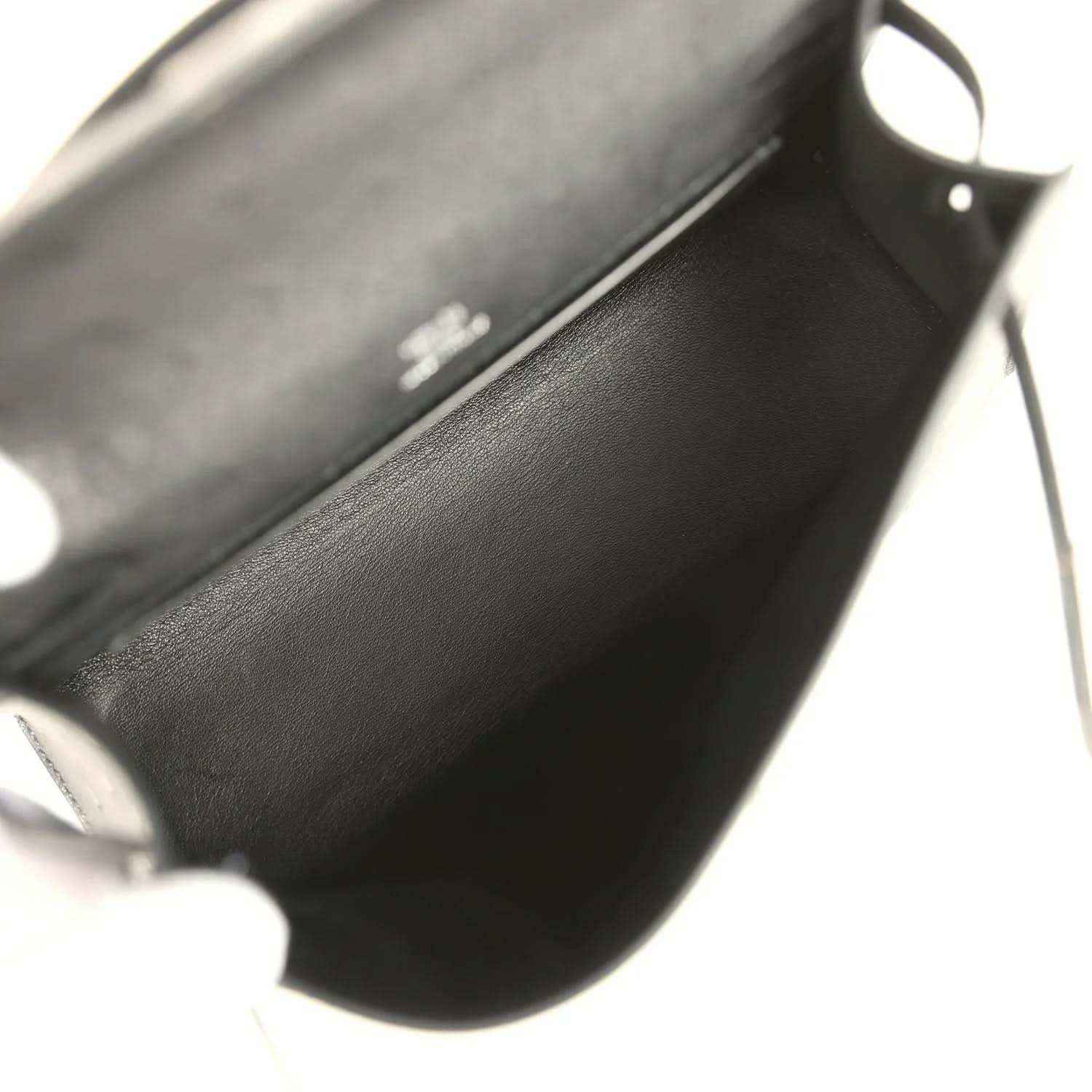 Leather clutch interior view with side hardware and stitching