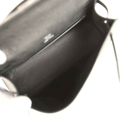 Leather clutch interior view with side hardware and stitching