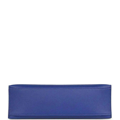Electric blue leather pochette back panel with top-edge piping and reinforced seams