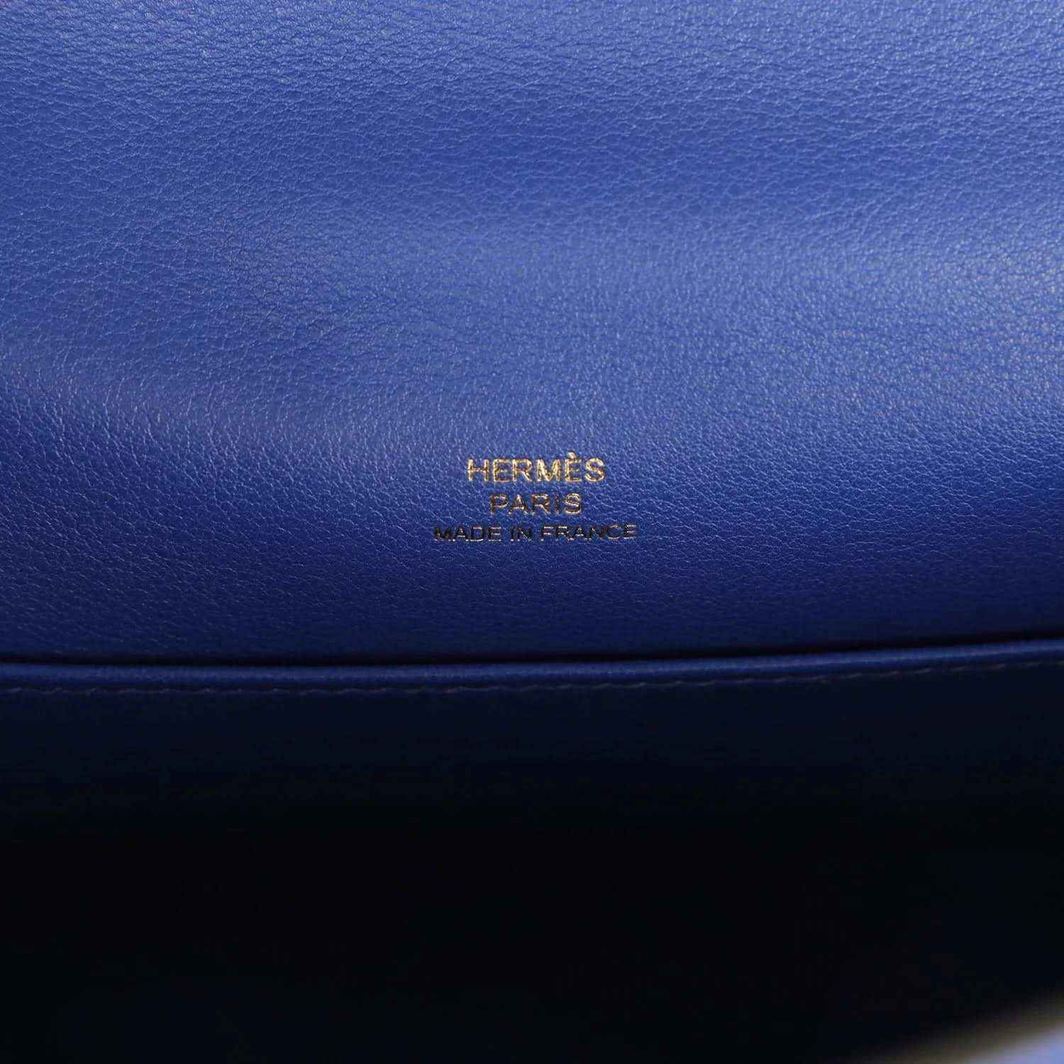 Hermès logo embossed on electric blue leather pochette