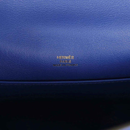 Hermès logo embossed on electric blue leather pochette